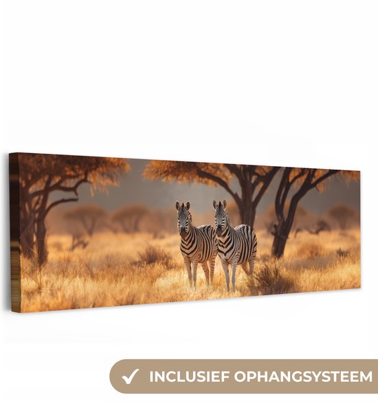 Canvas schilderij 150x50 cm - Exclusieve wanddecoratie Zebra's - Savannelandschap - Gras - Muurdecoratie woonkamer - Slaapkamer decoratie - Kamer accessoires - Schilderijen op canvas