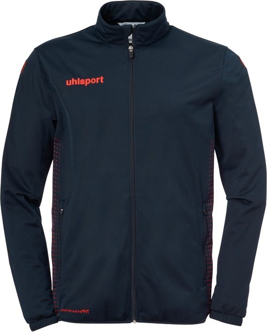 Donkerblauwe uhlsport trainingsjas met rits, rode logo's en stippenpatroon op de zijkanten.