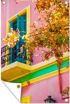 Tuinposters buiten Foto van een roze huis bij de wijk la Boca in Zuid-Amerika - 60x90 cm - Tuindoek - Buitenposter