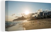 Le soleil est suspendu juste au-dessus des montagnes à la plage sud-américaine Ipanema Toile 40x20 cm - Tirage photo sur toile (Décoration murale salon / chambre)