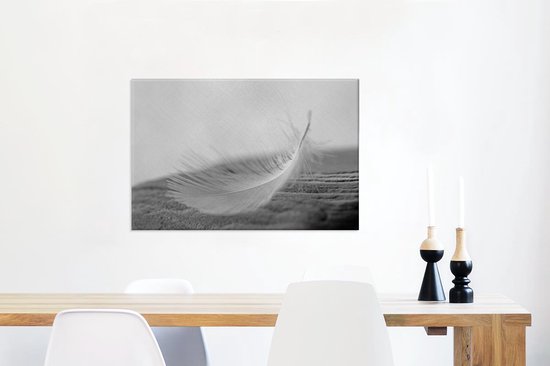 Tableau sur toile Gros plan d'une plume tourbillonnante - 60x40 cm - Décoration murale