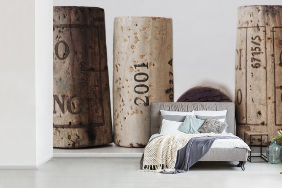 Quatre bouchons sur un fond blanc fotobehang