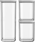 Trois boîtes de conservation Mepal Modula vides : une haute et deux plus petites empilées. Toutes avec des couvercles blancs.
