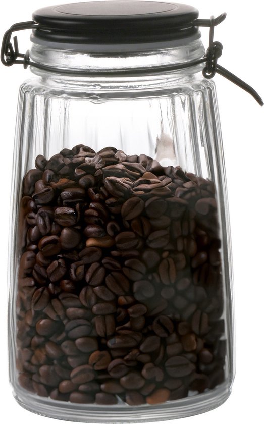 Bocal en verre nervuré, rempli de grains de café brun foncé, avec fermeture à levier noire.