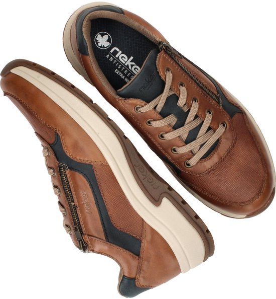 Bruine Rieker sneakers met veters en rits, contrasterende blauwe en beige accenten.
