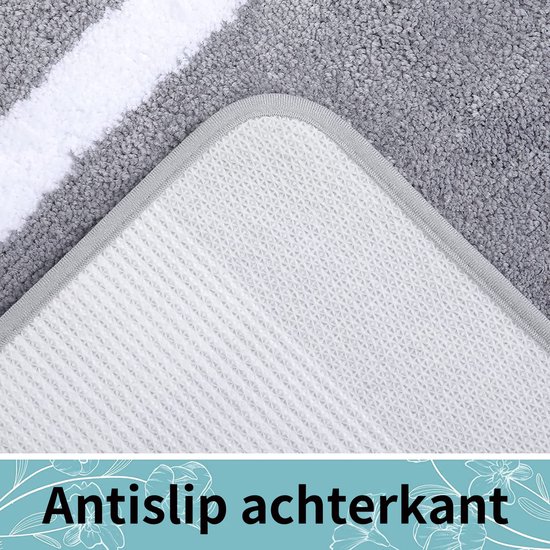 Onderkant van een grijs badkleed met witte rand en antislip achterkant.