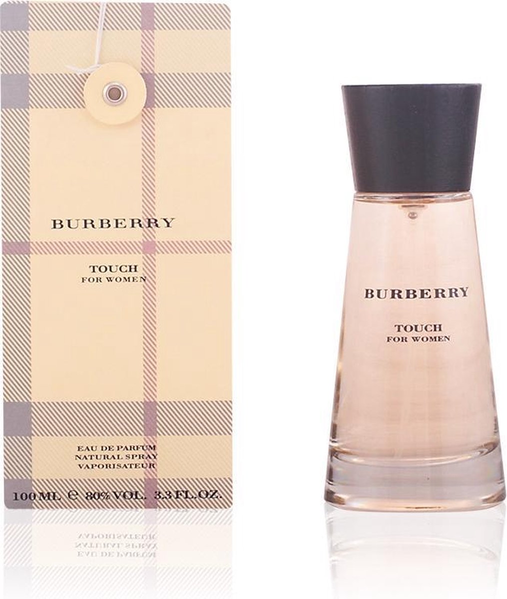 Glazen Burberry Touch parfumfles voor dames (100 ml) met bruine houten dop, naast de verpakking met ruitpatroon.