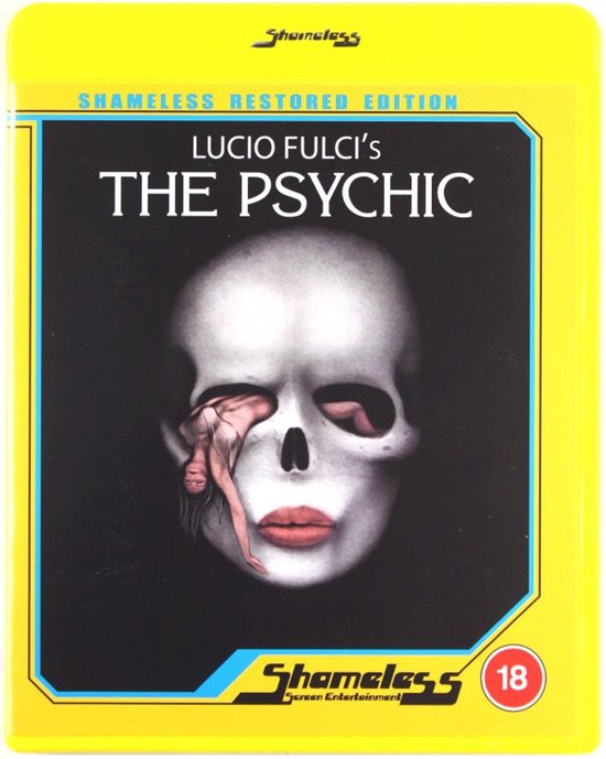Gele blu-ray hoes met de titel 'The Psychic', een schilderij van een schedel met een vrouw erin en rode lippen.