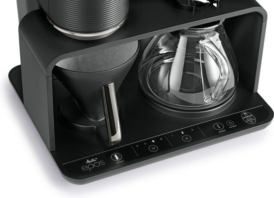 Detail van de bedieningsknoppen 'Melitta Epos', 'Grind' en 'Brew' op een zwart koffiezetapparaat.