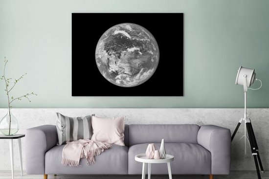 Peinture sur toile Image satellite d'une terre lumineuse - noir et