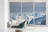 Behang - Fotobehang Doorkijk - Berg - Sneeuw - Breedte 525 cm x hoogte 350 cm
