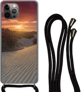 Hoesje met koord Geschikt voor iPhone 12 Pro - Zonsondergang bij het Nederlandse strand - Siliconen - Crossbody - Backcover met Koord - Telefoonhoesje met koord - Hoesje met touw