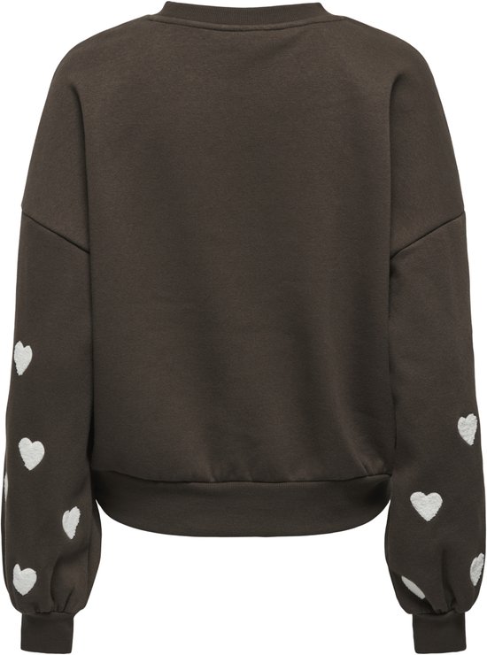 Achterkant van een donkerbruine sweater met volumineuze mouwen met witte hartjesprint.