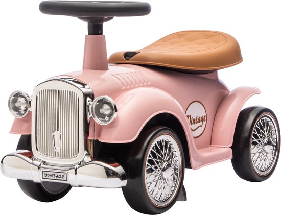 Roze loopauto met bruin zadel, chromen grille en 'Vintage' logo.