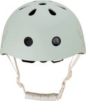 Lichtgroene kinderhelm met ventilatiegaten en witte bandjes.