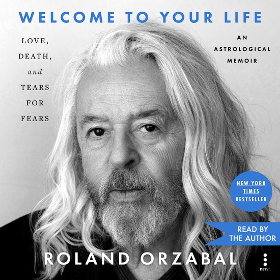 Roland Orzabal, auteur van "Welcome to Your Life", met een grijs, golvend haar en baard. Tekst: "Welcome to Your Life" en "An Astrological Memoir".