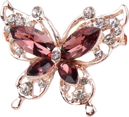 Broche dorée en forme de papillon ornée de strass violettes et blanches.