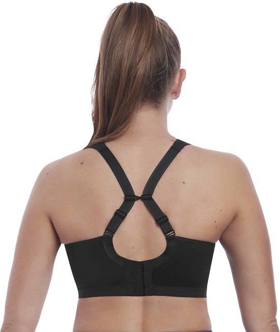 Soutien-gorge de sport noir Freya avec bretelles croisées dans le dos et fermetures réglables.