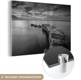 MuchoWow® Glasschilderij 120x80 cm - Schilderij acrylglas - Stenen pad naar de zee - Foto op glas - Schilderijen