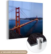 MuchoWow® Glasschilderij 20x20 cm - Schilderij acrylglas - Golden Gate Bridge verlicht in de avond - Foto op glas - Schilderijen