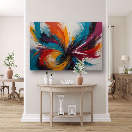 Abstract schilderij met wervelende kleuren zoals rood, oranje, blauw en paars, hangend boven een console tafel.