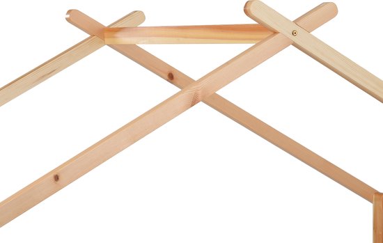 Close-up van een bedframe van licht hout, met gekruiste staanders en een dwarsbalk.