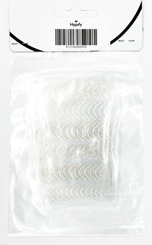 Zilverkleurige nagelstickers met halve cirkels en krullen, verpakt in plastic.