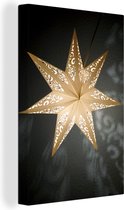Canvas schilderij 90x140 cm - Wanddecoratie Een verlichtte ster tijdens de winter - Muurdecoratie woonkamer - Slaapkamer decoratie - Kamer accessoires - Schilderijen - Kerstdecoratie voor Binnen - Kerstdecoratie Woonkamer - Kerstdecoratie in Huis