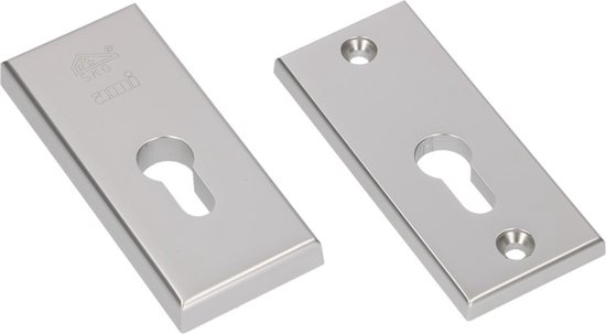 Twee zilverkleurige rozetten met sleutelgat, één met AMI-logo.