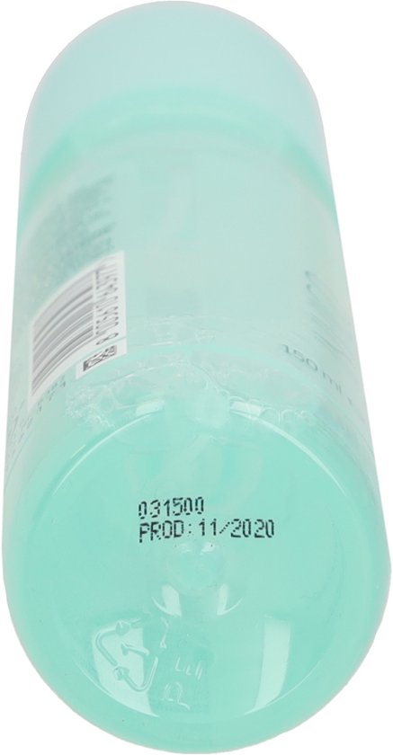 Onderkant van een mintgroene sprayfles met productiedatum 11/2020.