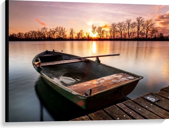 WallClassics - Canvas - Veroeste Vissersboot op het Water met Zonsondergang - 100x75 cm Foto op Canvas Schilderij (Wanddecoratie op Canvas)