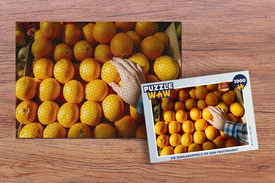 Puzzel Sinaasappel - Hand - Fruit - Markt - Legpuzzel - Puzzel 1000 stukjes volwassenen - PuzzleWow