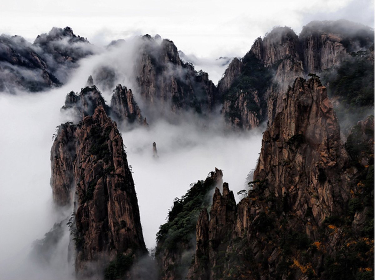 Fotobehang - Zee van wolken in Huangshan Mountain, China.
