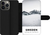 Bookcase Geschikt voor iPhone 13 Pro Max telefoonhoesje - Zweden - Sneeuw - Bomen - Met vakjes - Wallet case met magneetsluiting