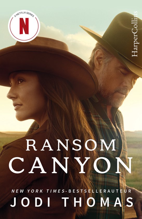 Boekcover met "RANSOM CANYON" en "JODI THOMAS". Een vrouw en een man met cowboyhoeden staan tegen een landelijke achtergrond.