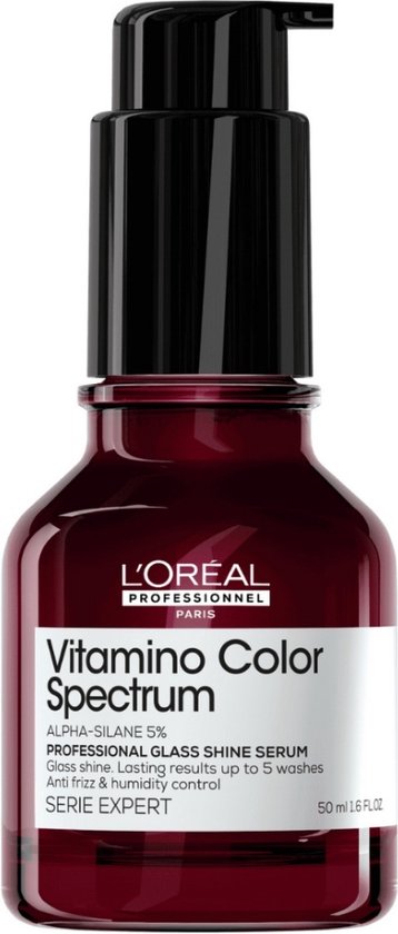 Donkerrode glazen fles met zwarte pompdispenser. Witte en grijze label met "L'Oréal Professionnel Vitamino Color Spectrum".