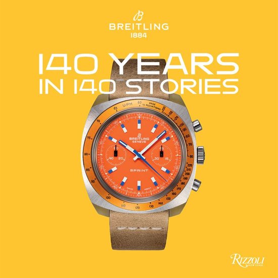 Een Breitling horloge met oranje wijzerplaat en bruin bandje, met de tekst '140 YEARS IN 140 STORIES'.
