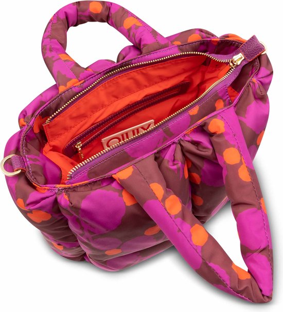 Paarse en oranje cirkels op bruine puffy handtas met dubbele handvatten en open rits.