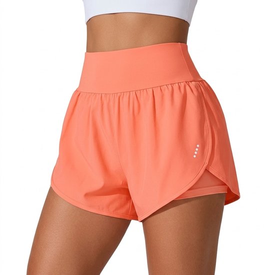 Close-up van een oranje dames sportbroekje met hoge taille, elastische band en splitjes aan de zijkant.