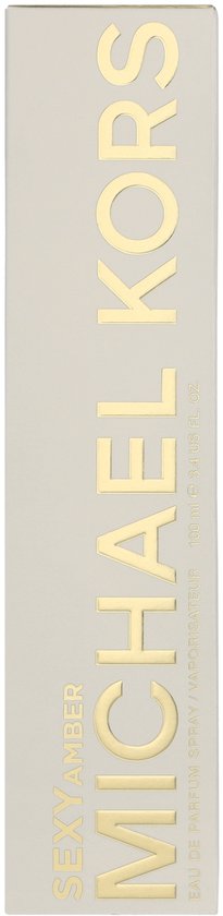 Emballage blanc avec texte doré vertical : MICHAEL KORS, SEXY AMBER.