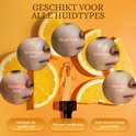 Vijf close-ups van verschillende huidtypes (gemengde, droge, vette, gevoelige, normale huid) te midden van sinaasappelschijfjes.