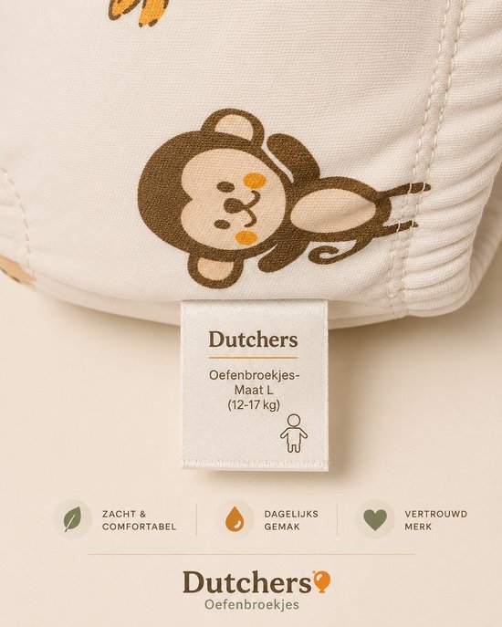Detail van een oefenbroekje met een aapjesprint en het merklabel.