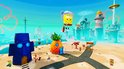 SpongeBob zweeft met een roze helm, pal aan het strand met ananas en blauw huis.