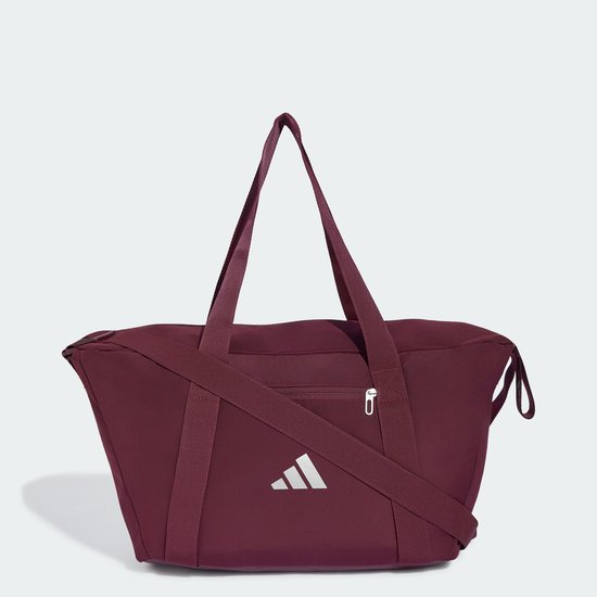 Bordeauxrode sporttas met hengsels, een schouderband en een zilverkleurig Adidas logo.
