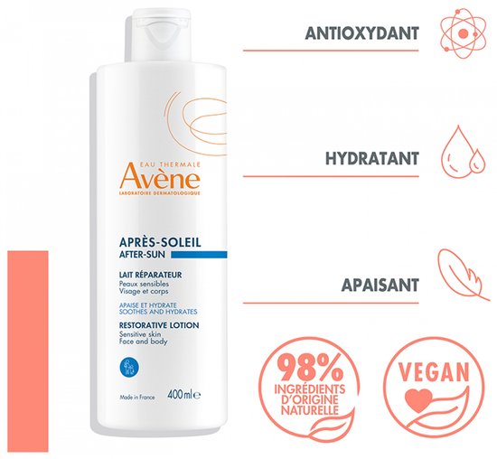 Witte fles Avene After-Sun herstellende lotion met de tekst "98% natuurlijke ingrediënten" en "Vegan".