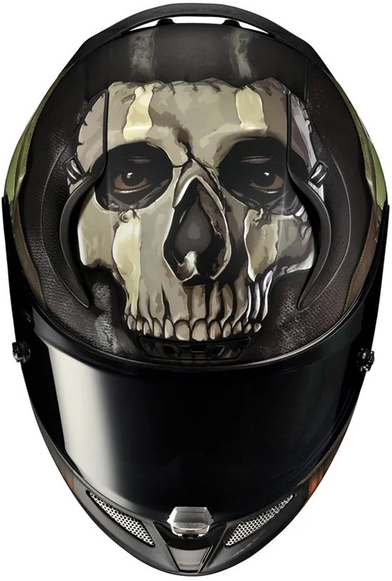 Zicht op de bovenkant van een zwarte integraalhelm met een doodshoofdprint in groen en bruin.