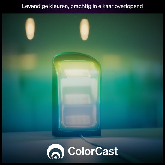 Une lampe Philips Hue Play noire émettant une lumière verte, jaune et bleue dans une pièce.