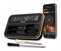 Inkbird BBQ thermometer met twee sondes, en een smartphone met app. Toont 'White' 31°C, 'Black' 42°C en 68°C. Zwarte behuizing met gouden rand.