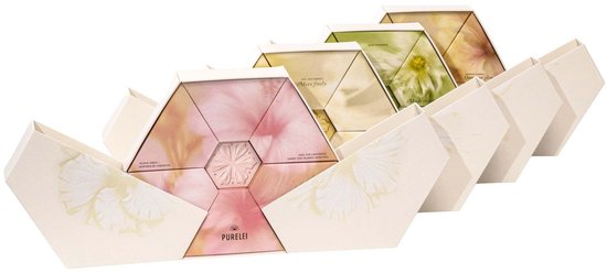 Witte Purelei adventskalender uitgevouwen, toont vier hexagonale compartimenten met bloemenprints in pastelkleuren: roze, geel, groen, oranje.
