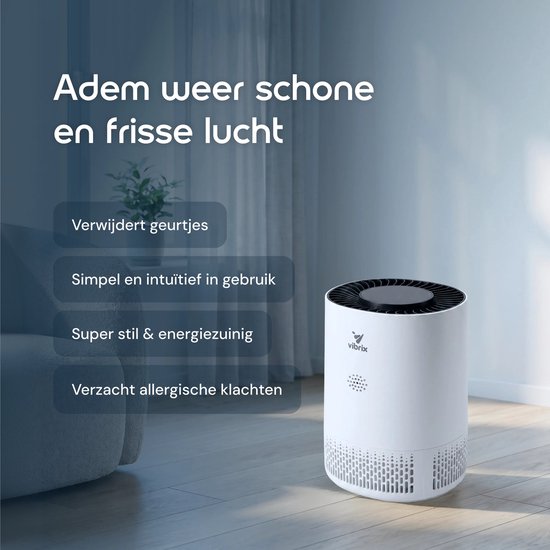 Witte Vibrix luchtreiniger op een houten vloer in een woonkamer.